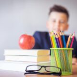 Boy sitting behind a study desk