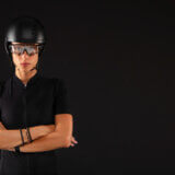 Woman cyclist wearing sports glasses and helmet