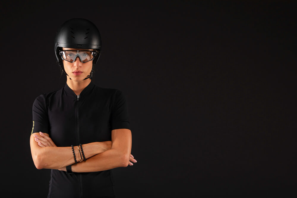 Woman cyclist wearing sports glasses and helmet